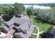 Aerial view of property with well-manicured lawns, mature trees, and a glimpse of the nearby lake at 10652 W Florida Ave # D, Lakewood, CO 80232