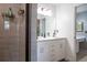 Modern bathroom showcasing a glass shower and stylish vanity with storage, blending functionality with aesthetic appeal at 10652 W Florida Ave # D, Lakewood, CO 80232