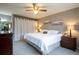 Cozy bedroom with comfortable king bed, soft lighting, and tasteful decor, promoting relaxation at 10652 W Florida Ave # D, Lakewood, CO 80232