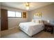 Calm bedroom with neutral colors, plush bed, and soft lighting for a serene and restful atmosphere at 10652 W Florida Ave # D, Lakewood, CO 80232