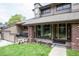 Charming home with a well-manicured lawn, inviting porch, and traditional architectural details at 10652 W Florida Ave # D, Lakewood, CO 80232