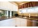 A bright kitchen featuring white cabinets, stainless steel appliances, and granite countertops at 10652 W Florida Ave # D, Lakewood, CO 80232