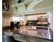 A kitchen featuring granite countertops and white cabinetry offering a stylish cooking space at 10652 W Florida Ave # D, Lakewood, CO 80232