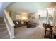 Cozy carpeted living room with neutral-toned furniture, fireplace, and ample natural light at 10652 W Florida Ave # D, Lakewood, CO 80232