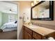 Bright bathroom vanity area next to bedroom; great natural light from bedroom windows at 1780 Roslyn St, Denver, CO 80220