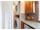 Conveniently located stacked washer and dryer in kitchen area at 1780 Roslyn St, Denver, CO 80220