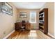 Office space featuring hardwood floors and a classic wood desk at 1780 Roslyn St, Denver, CO 80220