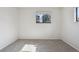 Bedroom with carpeted floor, window providing natural light, and neutral wall color at 4710 E Louisiana Ave, Denver, CO 80246