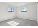 Bedroom with carpeted floor, windows providing natural light, and neutral wall color at 4710 E Louisiana Ave, Denver, CO 80246