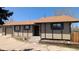 Charming tan home with green trim and a well-maintained front yard under a clear blue sky at 4710 E Louisiana Ave, Denver, CO 80246