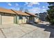 Charming exterior view of home featuring a garage and extended driveway at 4710 E Louisiana Ave, Denver, CO 80246