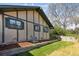 Exterior view of home with lush green lawn and side yard, showing home's siding and green trim at 4710 E Louisiana Ave, Denver, CO 80246