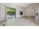 Bright living room featuring sliding glass door and modern fireplace at 4710 E Louisiana Ave, Denver, CO 80246