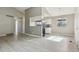 Bright living room featuring vaulted ceilings and stylish flooring at 4710 E Louisiana Ave, Denver, CO 80246