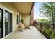 Private balcony features outdoor seating, iron railing and views of the city at 2240 N Clay St # 309, Denver, CO 80211