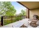 Outdoor balcony featuring comfortable seating and a grill with a view of the surrounding landscape at 2240 N Clay St # 309, Denver, CO 80211