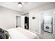 Bedroom with closet, carpeted floors and ensuite laundry with washer and dryer at 2240 N Clay St # 309, Denver, CO 80211