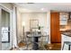 Cozy dining area next to the kitchen features modern furnishings, a large window, and a grill at 2240 N Clay St # 309, Denver, CO 80211