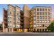 Apartment building exterior featuring multi-level balconies and an underground parking garage at 2240 N Clay St # 309, Denver, CO 80211