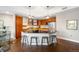 Kitchen with modern appliances, dark countertops, a large island and hardwood floors at 2240 N Clay St # 309, Denver, CO 80211