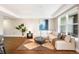Bright living room featuring hardwood floors, large windows and a comfortable couch at 2240 N Clay St # 309, Denver, CO 80211