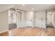 Basement hallway featuring laminate flooring and doorways into other rooms at 175 S Emerson St, Denver, CO 80209