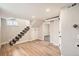 Finished basement area features a staircase, storage, and a doorway to another room at 175 S Emerson St, Denver, CO 80209