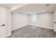 Finished basement area with a window, neutral paint, and carpeted floors at 175 S Emerson St, Denver, CO 80209