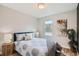 Calming bedroom features neutral tones and plenty of natural light at 175 S Emerson St, Denver, CO 80209