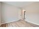 Spacious bedroom featuring modern laminate flooring, neutral paint, and a walk in closet at 175 S Emerson St, Denver, CO 80209
