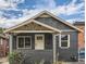 Cozy single-story home with dark brick, light trim, and a covered porch area at 175 S Emerson St, Denver, CO 80209
