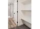 Hallway area to bathroom showcases built-in shelving, creating functional storage at 175 S Emerson St, Denver, CO 80209