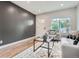 Relaxing living room with wood-look floors and lots of natural light at 175 S Emerson St, Denver, CO 80209