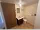 Bathroom featuring tile floors, a single sink vanity, mirror, light fixture, and a toilet at 19351 E Purdue Cir, Aurora, CO 80013