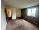 Neutral bedroom with carpeted floor, closet, and window with outdoor view at 19351 E Purdue Cir, Aurora, CO 80013
