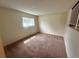 Loft area with carpet floor and window with outdoor view at 19351 E Purdue Cir, Aurora, CO 80013