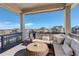 Relaxing outdoor balcony with comfortable seating and scenic neighborhood views at 23230 E Rockinghorse Pkwy, Aurora, CO 80016