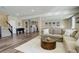 Spacious basement area with a comfortable sectional, wet bar, and access to a game area at 23230 E Rockinghorse Pkwy, Aurora, CO 80016