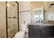 Bathroom featuring a modern vanity, granite countertop, and a glass-enclosed shower at 23230 E Rockinghorse Pkwy, Aurora, CO 80016