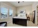 Cozy bedroom with a queen-sized bed, soft lighting, and a window with a view at 23230 E Rockinghorse Pkwy, Aurora, CO 80016