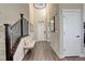Inviting foyer with hardwood floors, staircase, and ample natural light from the transom windows at 23230 E Rockinghorse Pkwy, Aurora, CO 80016