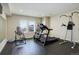Home gym featuring exercise equipment and a rubber floor at 23230 E Rockinghorse Pkwy, Aurora, CO 80016