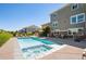 Beautiful backyard with a pool, hot tub, and seating area perfect for entertaining at 23230 E Rockinghorse Pkwy, Aurora, CO 80016