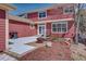 Outdoor living space featuring a grill, patio, firepit and mulched area at 8641 Coors St, Arvada, CO 80005