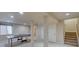 Finished basement with ping pong table and stairs at 8641 Coors St, Arvada, CO 80005