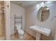 Bathroom featuring sink, toilet, and tile shower at 8641 Coors St, Arvada, CO 80005