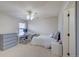 Comfortable bedroom with ceiling fan, cozy bed, desk, and dresser at 8641 Coors St, Arvada, CO 80005