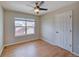 Cozy bedroom with hardwood floors, a window providing natural light, and ample space for a comfortable setup at 8641 Coors St, Arvada, CO 80005