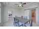 Bright dining room featuring a tray ceiling, modern lighting, and sliding barn door detail at 8641 Coors St, Arvada, CO 80005
