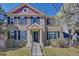 Charming two-story home with well-maintained lawn, brick facade, and black shutters for a classic curb appeal at 8641 Coors St, Arvada, CO 80005